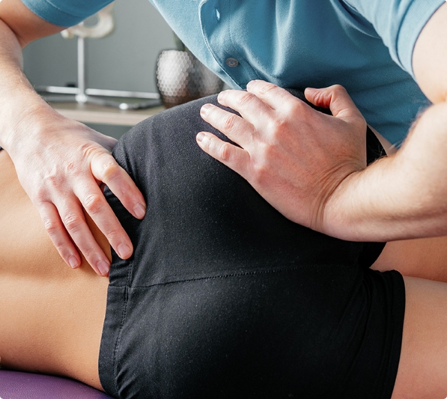 Physical Therapist massaging a client